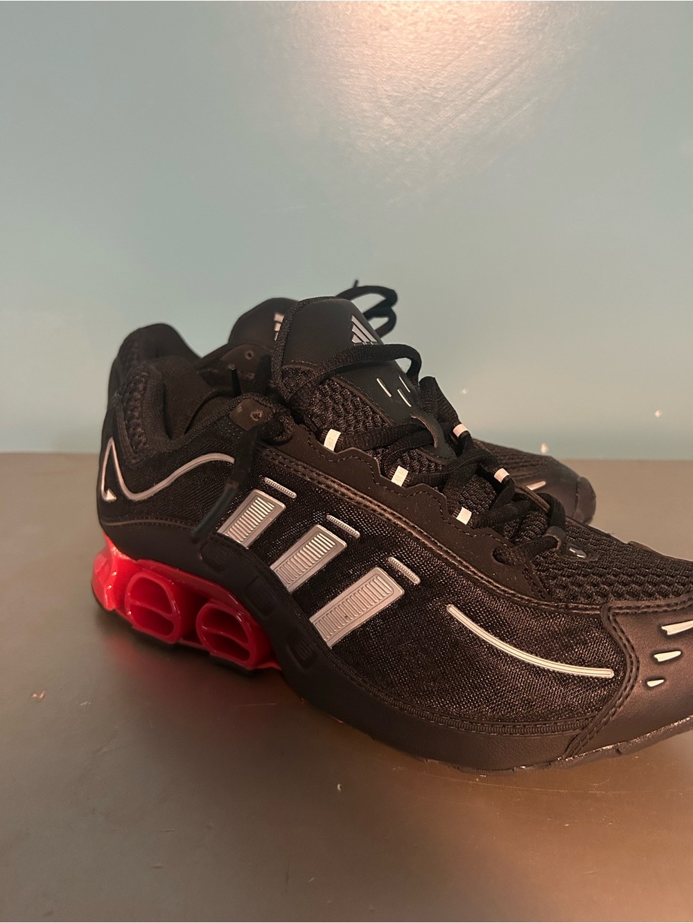 adidas Black Athletic Shoes with Red Heel Pods